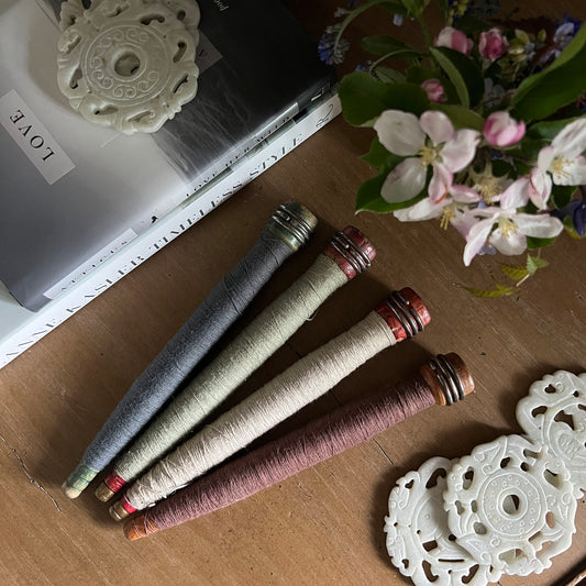 From Utility to Decor:  Vintage Industrial Bobbin Spindles with Yarn